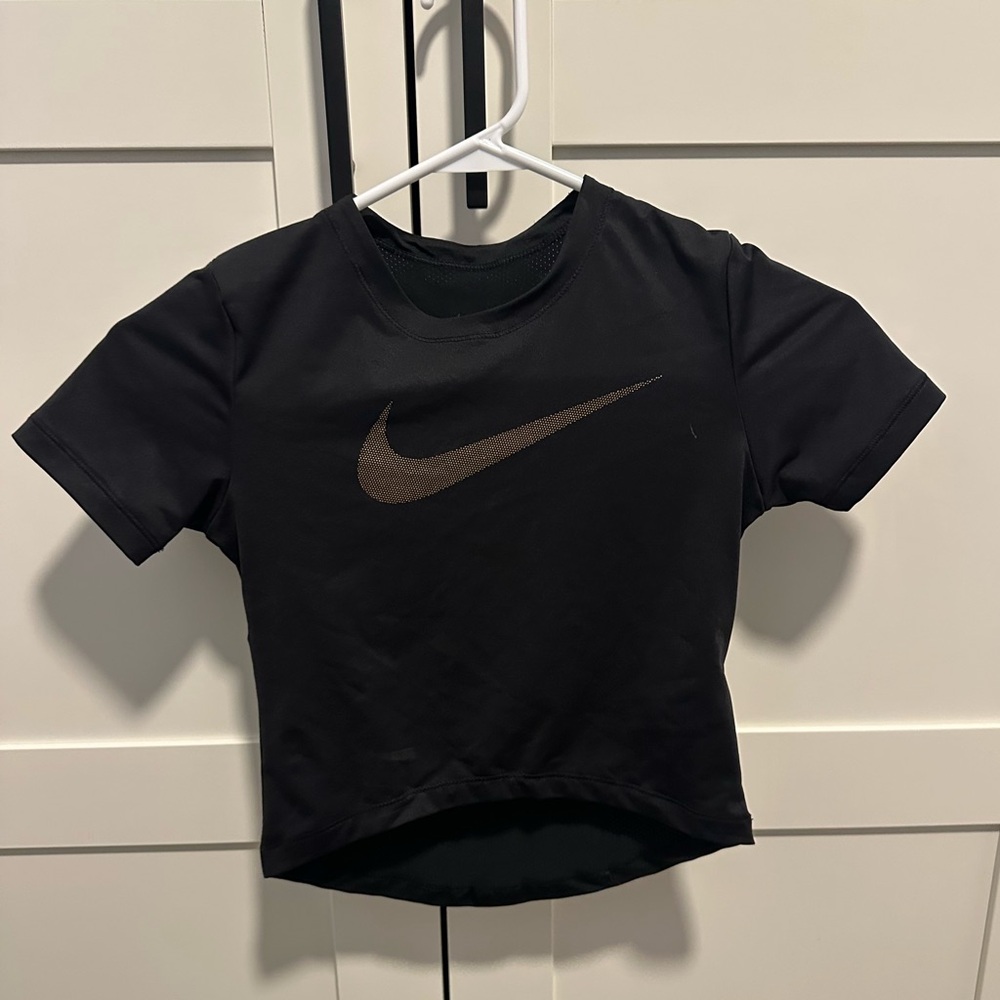Spandex, form fitting Nike swoosh crop top